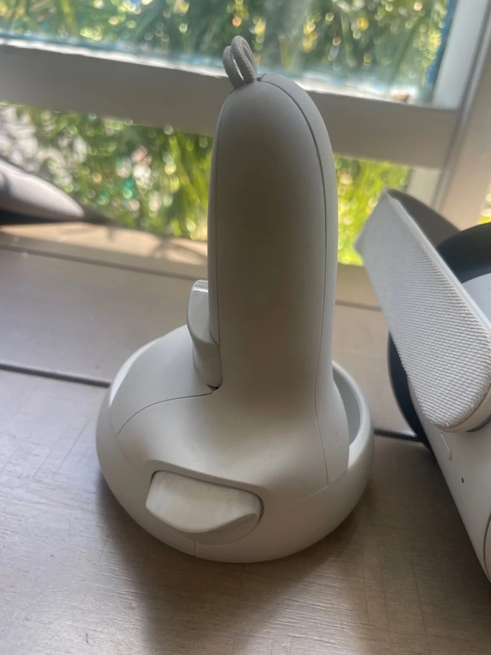 Oculus white standalone VR headset with white controllers and black face gasket